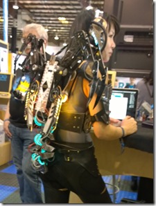 Woman augmented with electronics and wing-claws
